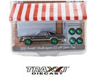 1976 Chevrolet Chevelle Laguna S3 Chase by GreenLight in 1:64 scale, black with gold trim, green wheels and four matching spare tires.