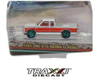 1984 GMC S-15 Sierra Classic Green Machine Chase by GreenLight in 1:64 scale with red and white paint, extended cab and green wheels.