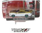 2021 Ford Mustang Mach 1 White and Gold Green Machine Chase by GreenLight in 1:64 scale with metallic green wheels and Hurst packaging.