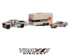 Side profile of Texaco-themed Silverado towing enclosed race trailer with matching Camaro RS.