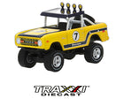 1972 Ford Bronco Baja Firestone GreenLight All-Terrain Series 6 front three-quarter view showing lifted suspension, roof lights, and off-road tires