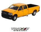 GreenLight 1:64 2021 Ram 3500 Tradesman yellow crew cab pickup front three-quarter view with long bed and Cummins badging