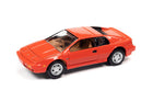 Johnny Lightning 1989 Lotus Esprit in Calypso Red front three-quarter view showing factory wheels and tan interior.