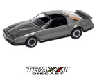 Johnny Lightning Classic Gold Collection 1984 Pontiac Firebird Trans Am in Silver Sand Gray on factory blister card packaging