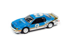 1986 Ford Thunderbird Stock Car Sunfire #9 Johnny Lightning 1:64 diecast in bright blue with gold and white racing graphics front three-quarter view.