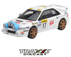 Mini GT 1999 Subaru Impreza WRC98 #17 Rally Monte Carlo 1:64 diecast in white shown from the front three-quarter angle with rally light pod and bronze wheels.